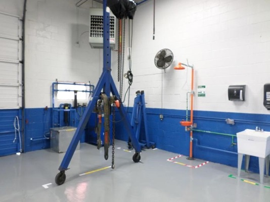 Forklift Repair Shop after implementing a 5S organizational system involving cleaning tools, organizing remaining items, and using floor marking tape